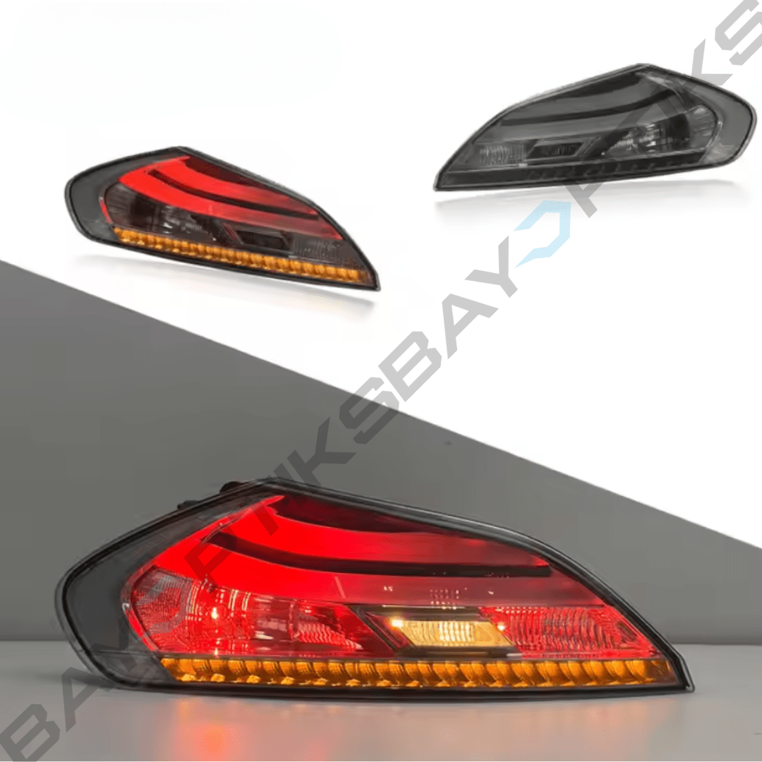 Car tail lights with red and orange lenses on a gray background